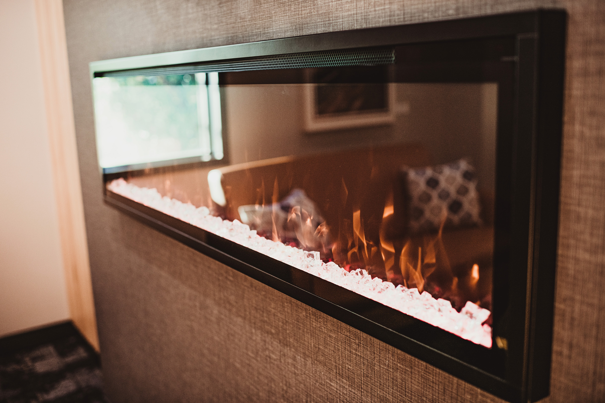 Glass faux fireplace with white crystal coals