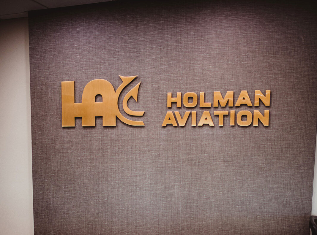 Holman aviation lobby sign