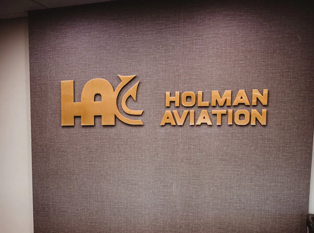 Holman aviation lobby sign