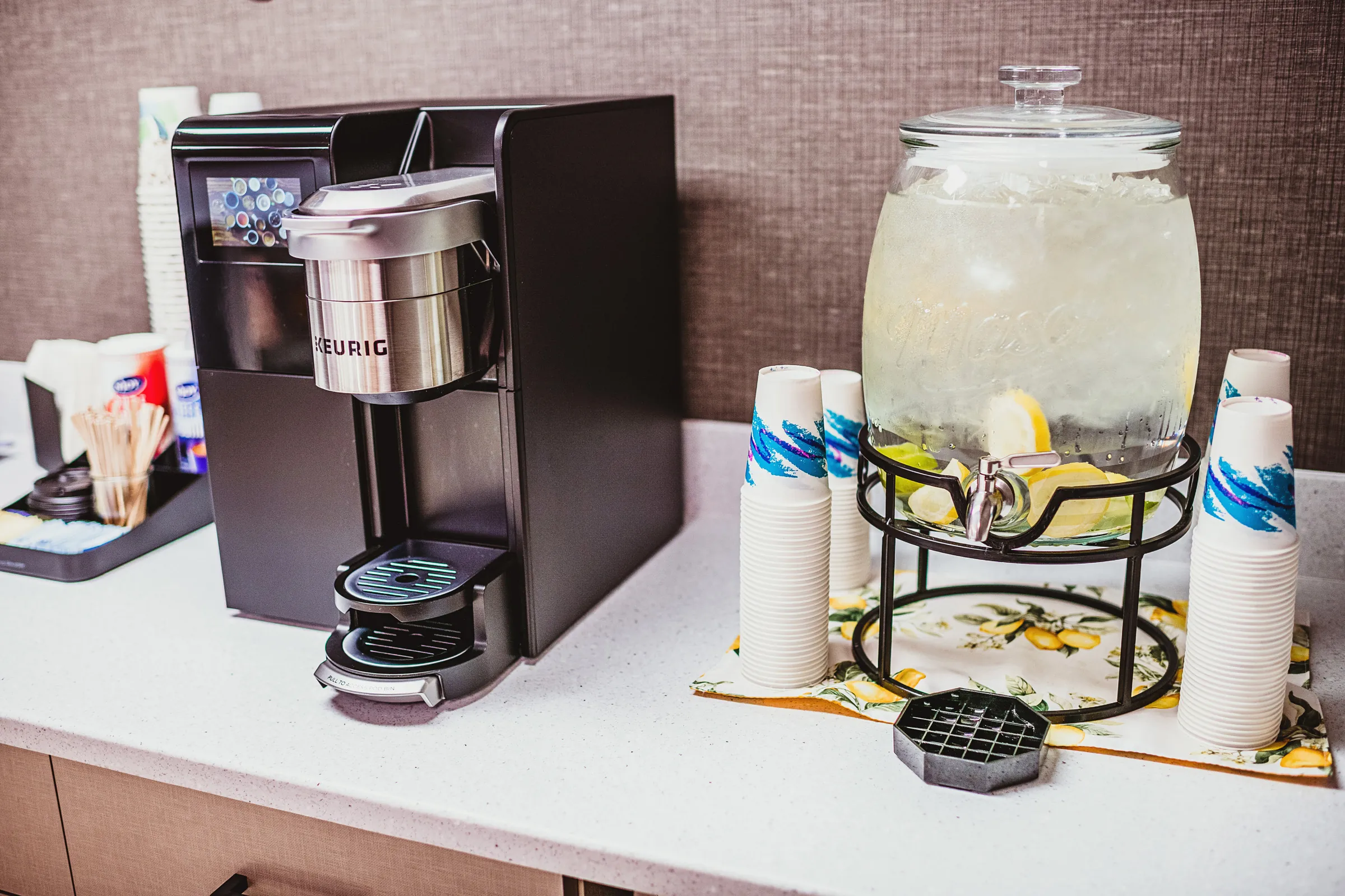 Close up of coffee bar and lemon water
